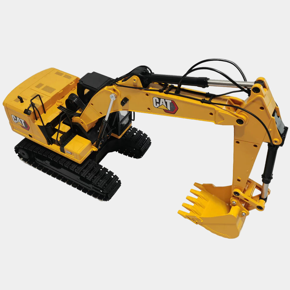 Yellow toy CAT excavator with black tracks