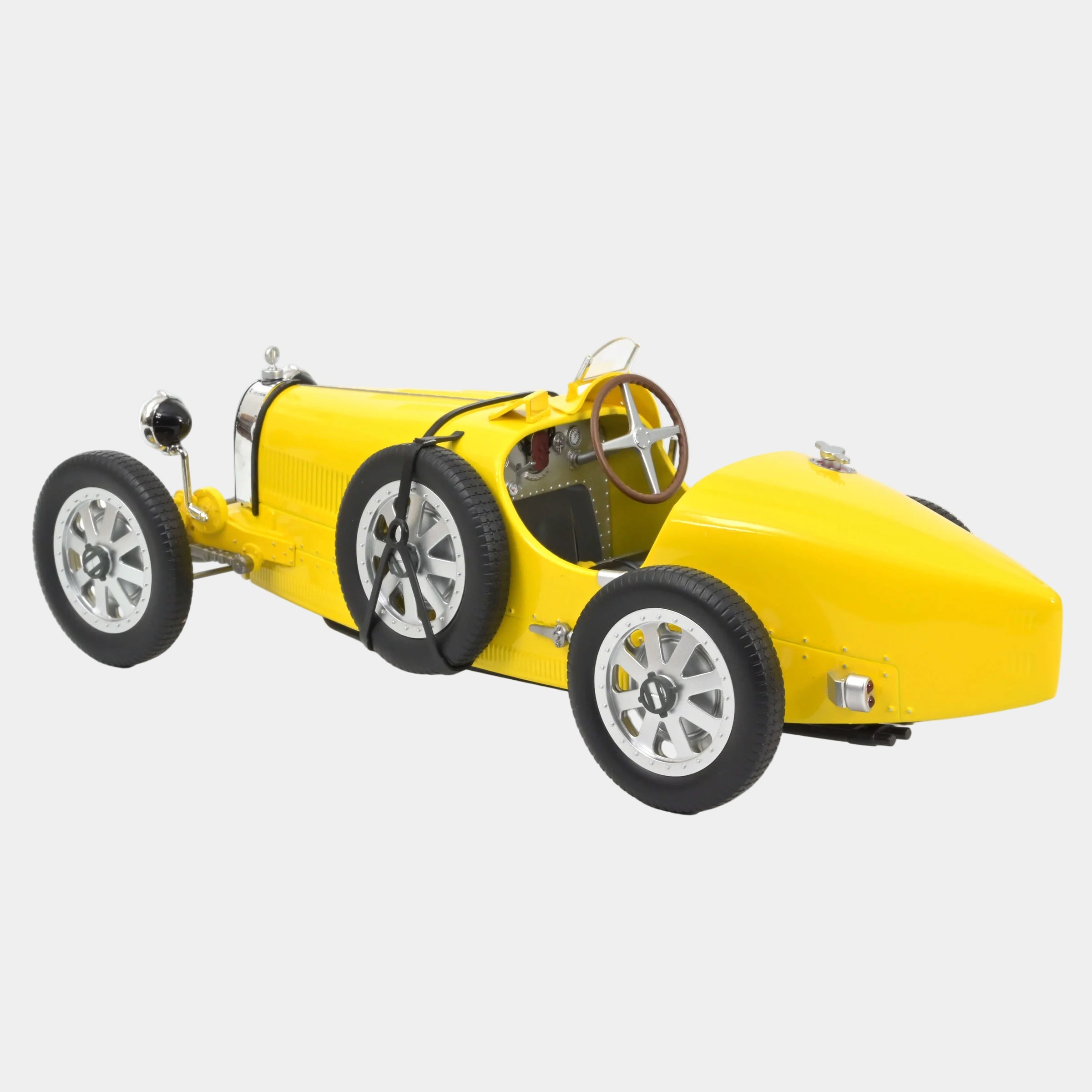 Yellow vintage car model on a white background