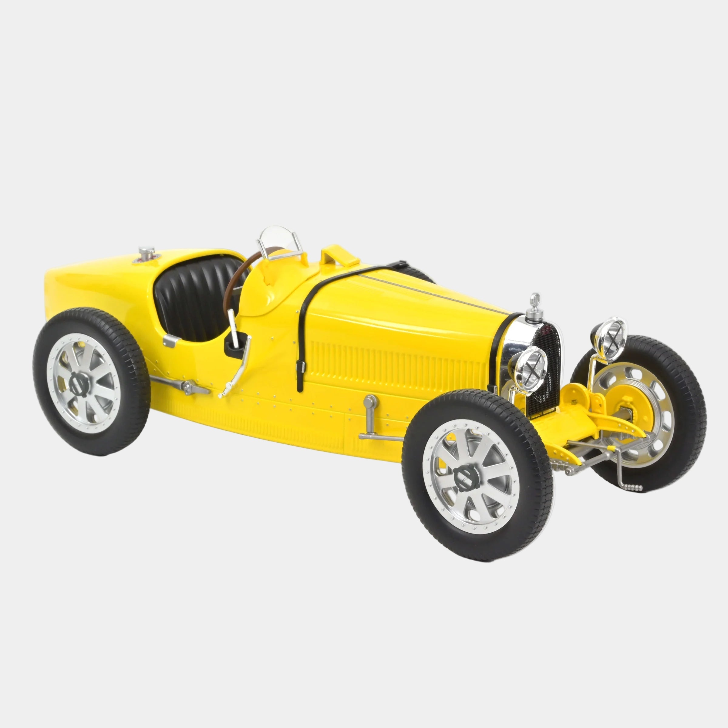 Yellow model car on a white background
