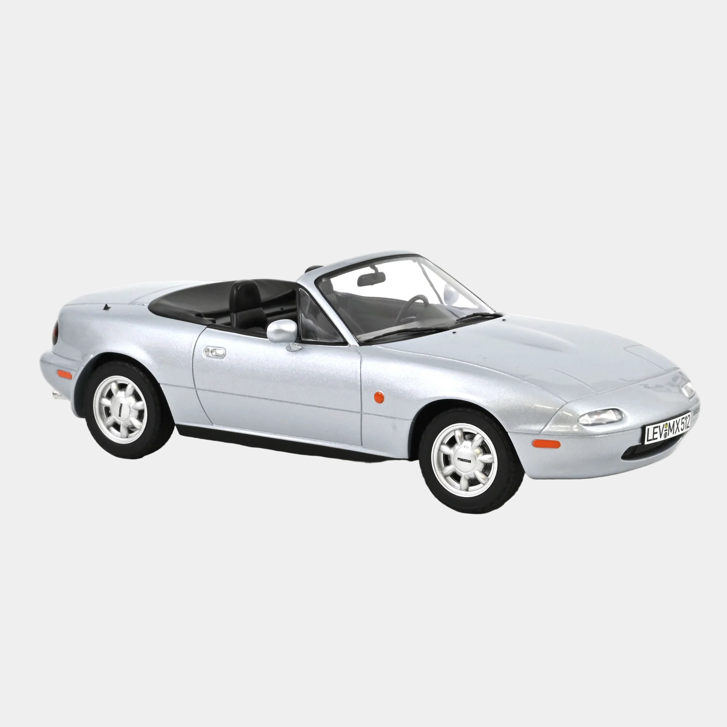 Silver convertible car on a white background