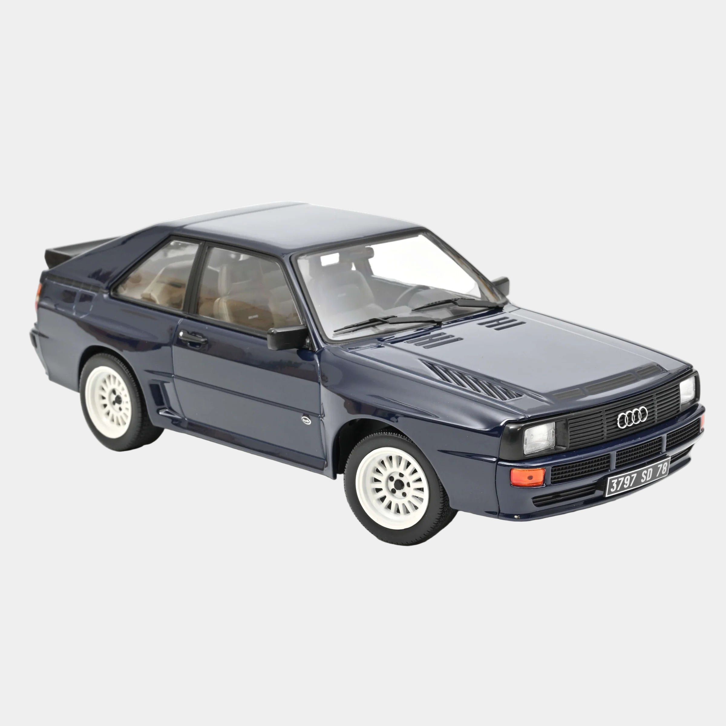 Model car of an Audi on a white background