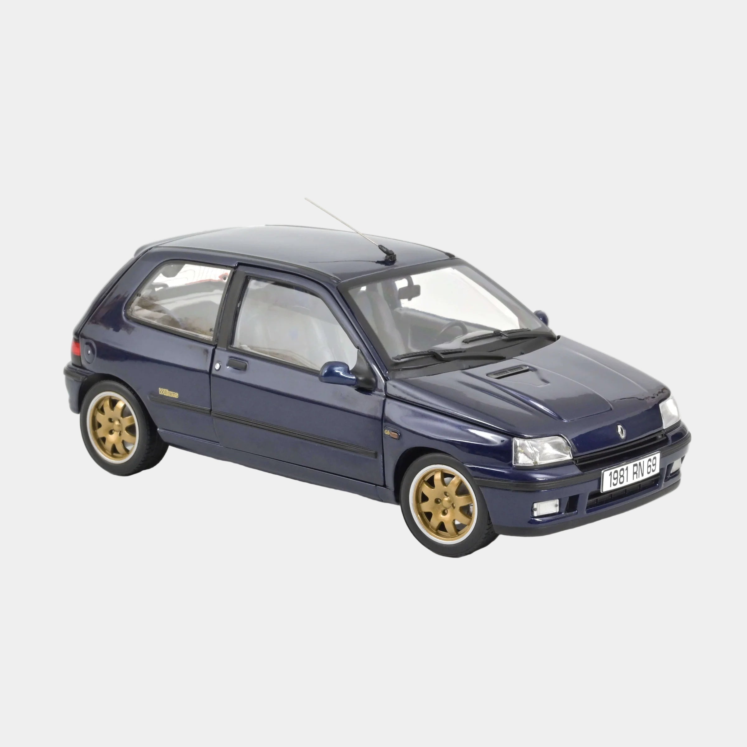 Model car of a blue hatchback with gold wheels on a white background